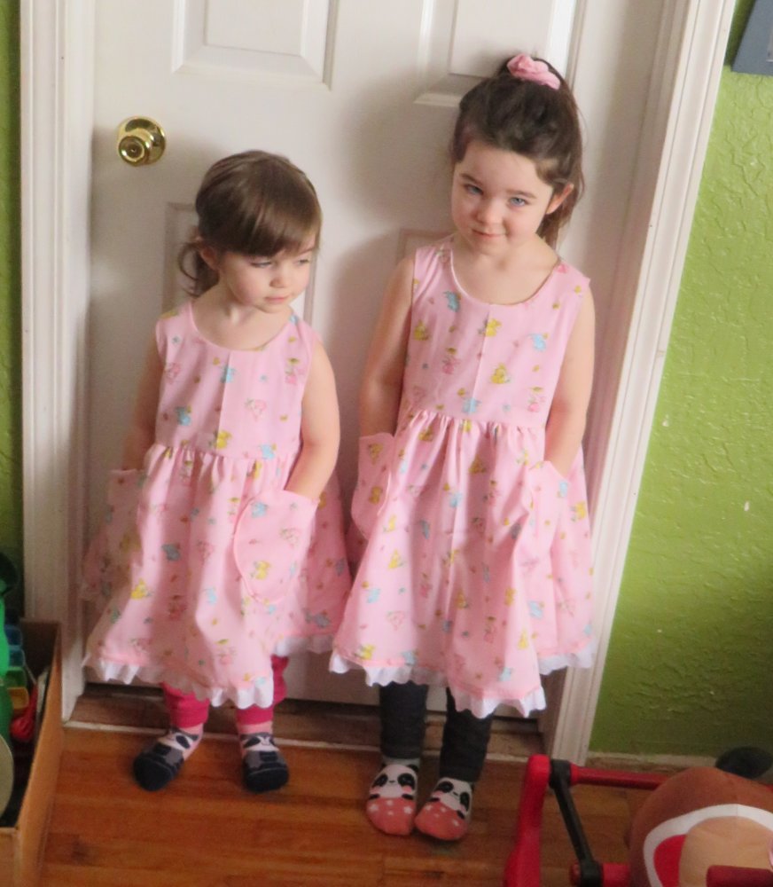 Evelyn and Izzy pink Kitty dresses.jpg