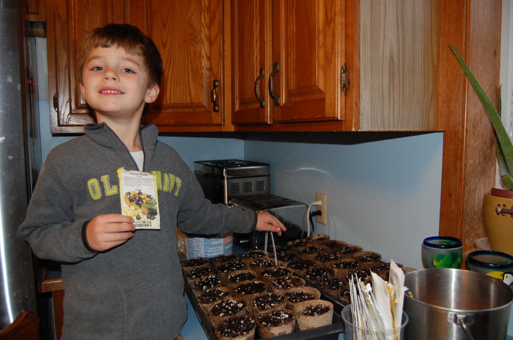 Gavin plannting seed.JPG