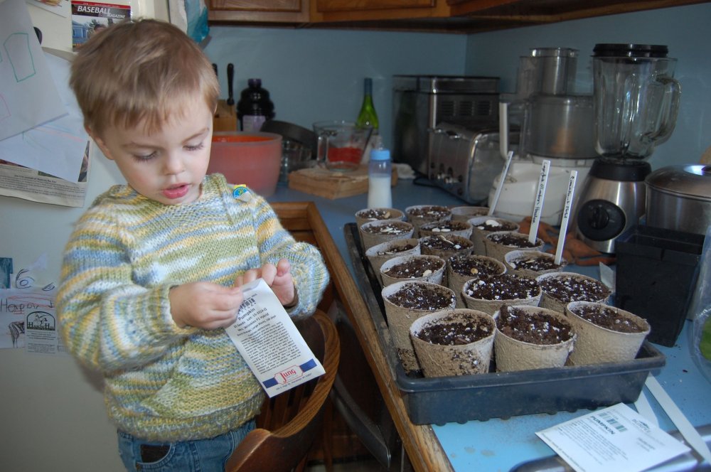 Landon planting seeds.jpg