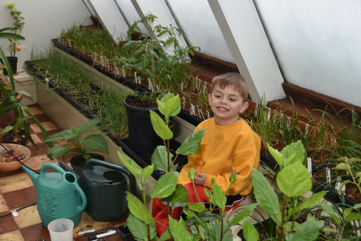 landon with plants teg.jpg
